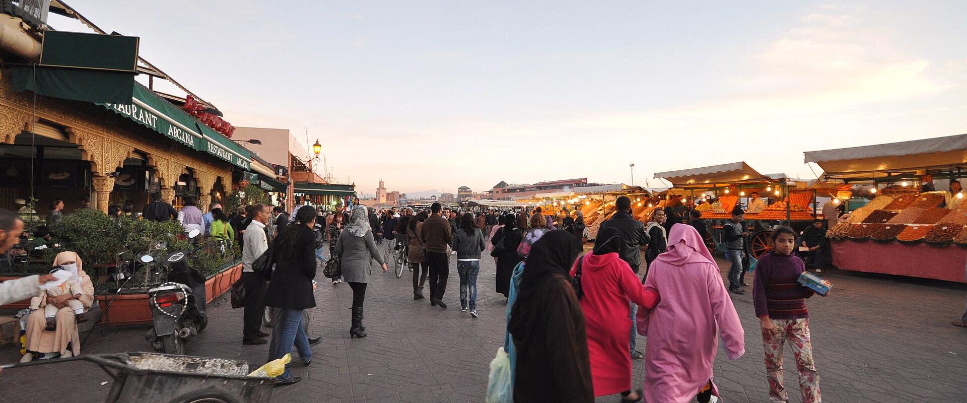 Crowds and stalls in Jemaa el-Fnaa square, Marrakech