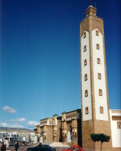 The minaret of a mosque in Agadir against a blue sky