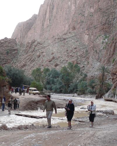 Walkers between the sheer walls of the Todra Gorge